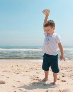 kid playing on the beach